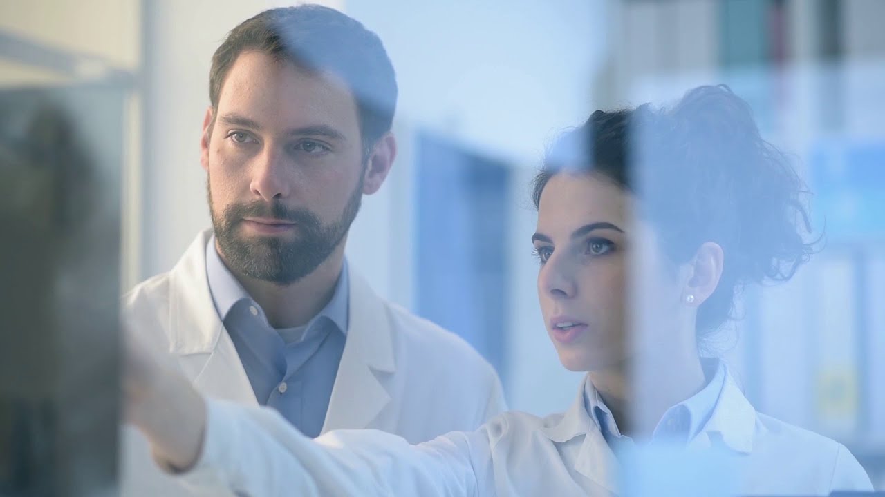 Doctors looking at a screen