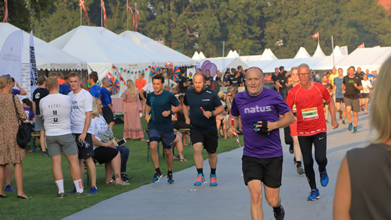Natus employees running in a race